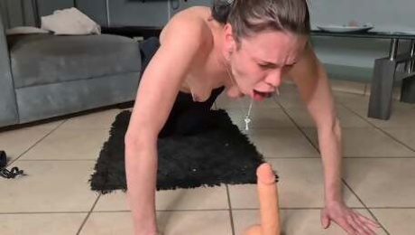 Slut-deep-throat gags herself with a dildo.